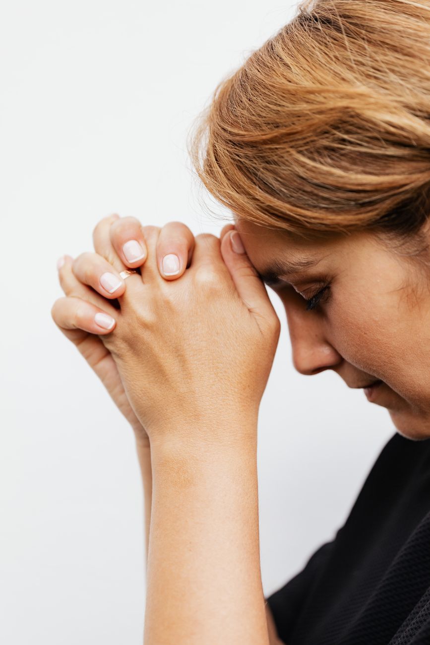 close up shot of a woman praying
